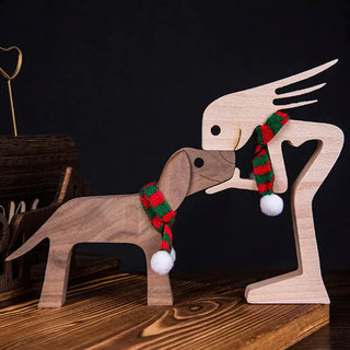 Dierenliefhebber - Tafeldecoratie met houten sculptuur pige og hund iført grønt tørklæde